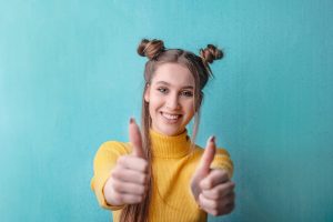 Woman giving two thumbs up
