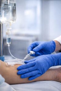 Close-up of IV hydration therapy being administered in a modern medical environment