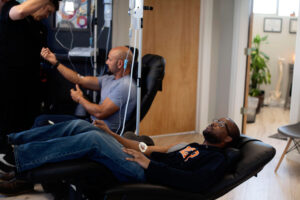 Patient receiving IV therapy for fatigue in a Boulder clinic under professional supervision