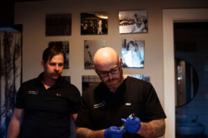 Medical professional preparing IV therapy treatment in a clinical setting in Boulder.