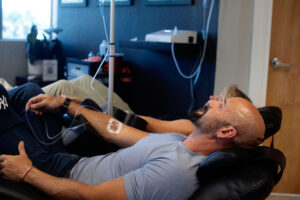 Patient receiving wellness support for recovery, hydration, and healthy aging